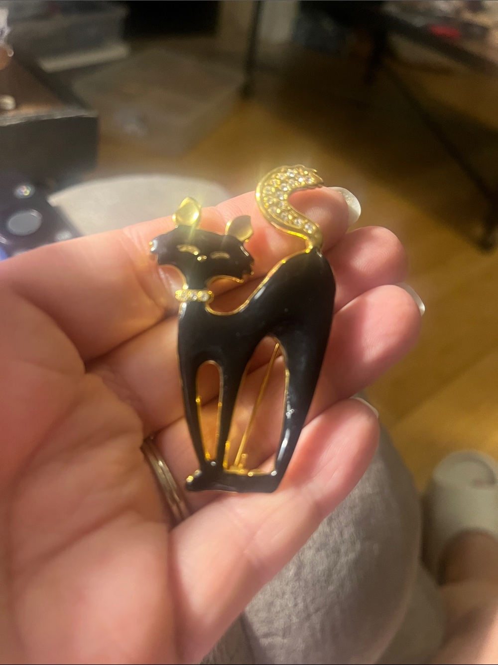 Black and gold enamel cat brooch